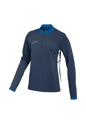 Haut de sport bleu marine à manches longues avec zip au quart, col et poignets bleus, panneaux latéraux blancs et logo Nike blanc sur la poitrine.