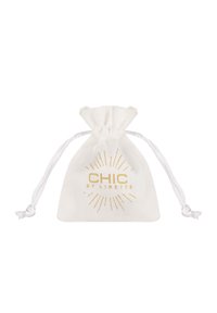 White fabric drawstring pouch with golden "CHIC by Lirette" logo and sunburst design, featuring a smooth texture and gathered top closure.