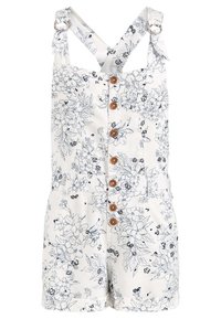 Rompers à imprimé floral en blanc avec des motifs de fleurs bleu foncé ; doté d'une fermeture à boutons sur le devant et de bretelles ajustables avec des anneaux en métal.