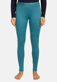 Turkosa leggings med en mjuk textur och en åtsittande design. Har en midja med logotyp; lämpliga för lager på lager eller träning.