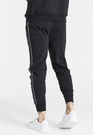 Pantalones deportivos - black