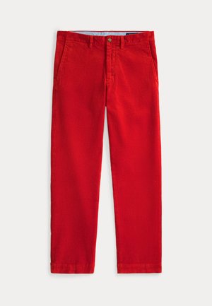 Pantalon en velours côtelé rouge vif avec poches avant, passants de ceinture et fermeture par boutons, posé à plat sur fond blanc.