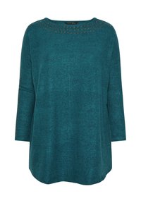 Top a maniche lunghe color turchese realizzato in tessuto morbido, con scollo rotondo decorato con occhielli metallici lungo il colletto e le maniche.
