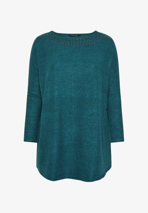 Top de manga larga en color azul verdoso, hecho de un tejido suave, que presenta un escote redondo adornado con ojales metálicos a lo largo del cuello y las mangas.