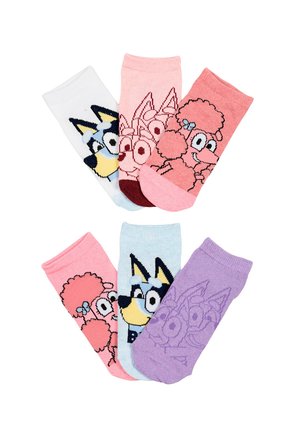 Six colorful children's socks with cartoon dog and poodle faces in pink, white, blue, and purple colors arranged in a circular pattern.