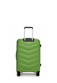 Valigia rigida verde con texture a zigzag, dettagli neri, manico retrattile e quattro ruote per la mobilità.