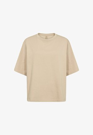 Beige túlméretezett pamut póló rövid ujjakkal, kerek nyakkivágással és sima textúrával. Nincsenek látható logók vagy minták.