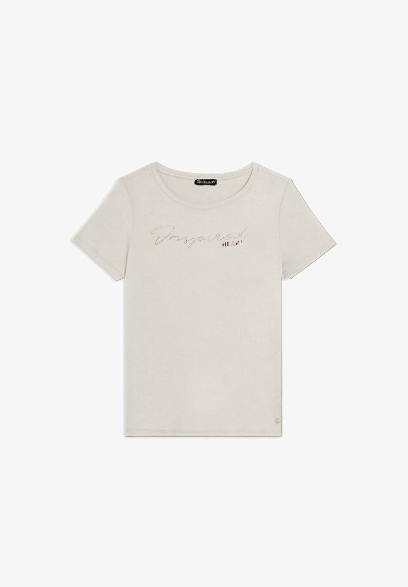 Camiseta de algodón beige claro con cuello redondo, mangas cortas y texto decorativo "Inspired HEART" con acentos brillantes en la parte frontal.