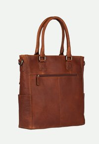 Sac fourre-tout en cuir marron avec deux poignées, poche zippée extérieure, texture lisse et forme rectangulaire. Aucun motif visible ni éléments de quincaillerie.