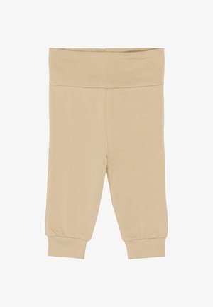 Beežid, pehmest, venivast puuvillasegust kangast retuusid. Neil on lai värvel ja jalasäärte juures elastsed mansetid. Üldiselt sile tekstuur.