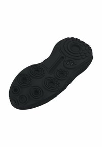 Semelle de chaussure de sport noire avec des motifs de traction circulaires et des rainures, présentant une texture lisse et un logo Under Armour près du talon.