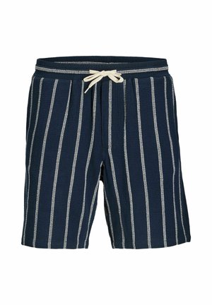 Marineblaue Shorts mit weißen vertikalen Streifen, elastischem Bund und beigefarbenem Kordelzug, der vorne in der Mitte zu einer Schleife gebunden ist.