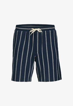 Tumši zili šorti ar baltām vertikālām svītrām, elastīgu jostu un bēša krāsas auklu, kas sasieta lokā priekšā centrā.