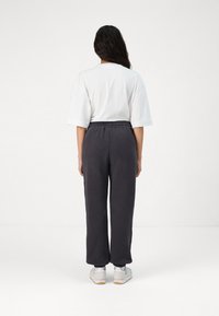 Rip Curl VARSITY PANTS - Trainingsbroek - washed black