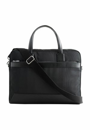 Black fabric laptop bag with leather accents. Features dual top handles and a detachable shoulder strap. Smooth texture and minimalist design.