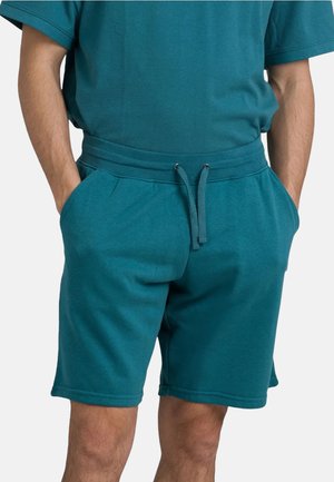 Pantaloni sportivi turchesi realizzati in tessuto morbido, con una vita elastica dotata di un cordoncino regolabile, tasche laterali e una vestibilità comoda.