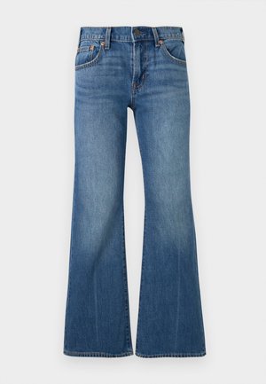 Μπλε τζιν παντελόνια με ψηλή μέση, κλασικό σχέδιο με πέντε τσέπες, μεταλλικό κουμπί και φαρδιά φούντα στα πόδια.