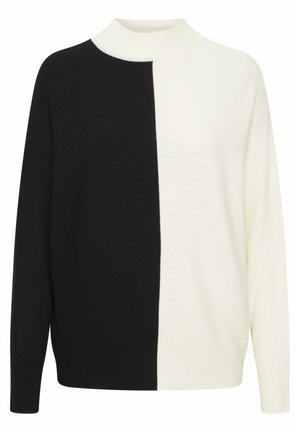 Czarny i biały sweter prążkowany z wysokim dekoltem; ma podzielony fason, długie rękawy i luźny krój. Teksturowany materiał na całej powierzchni.