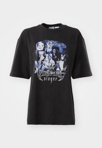 Black oversized t-shirt made of cotton, featuring a graphic print in blue tones with images and text related to "Buffy the Vampire Slayer."