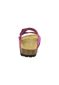 Bright pink sandal with a black sole, featuring a cork footbed. Adjustable strap and buckle detail for a secure fit. Flat design.