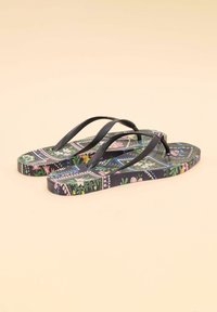 Flip-flops with black rubber straps, featuring a colorful floral pattern on the soles with geometric accents and a textured surface.
