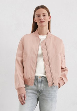 Light pink bomber jacket with a ribbed collar and cuffs, featuring a zip front and a diamond quilted design on the interior.