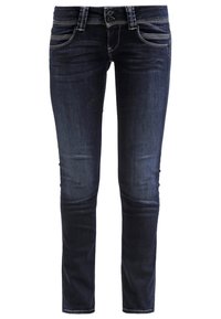 Jeans de mezclilla azul oscuro con corte ajustado, que cuentan con un cierre de botón clásico, bolsillos laterales y un sutil desgaste a lo largo de los muslos.