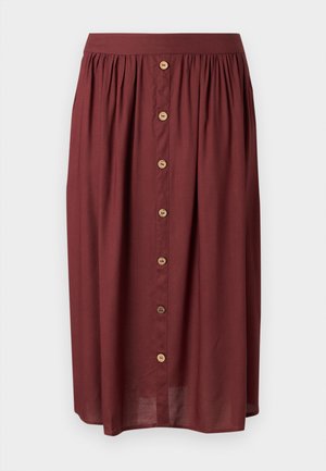 Jupe mi-longue de couleur rouille avec une taille froncée et une rangée centrale de sept boutons en bois.
