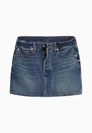 Μίνι φούστα από τζιν σε σκούρο μπλε χρώμα. Διαθέτει κλείσιμο με πέντε κουμπιά, δύο μπροστινές τσέπες και διακριτική ξεθώριαση. Ραφές γύρω από τις άκρες.