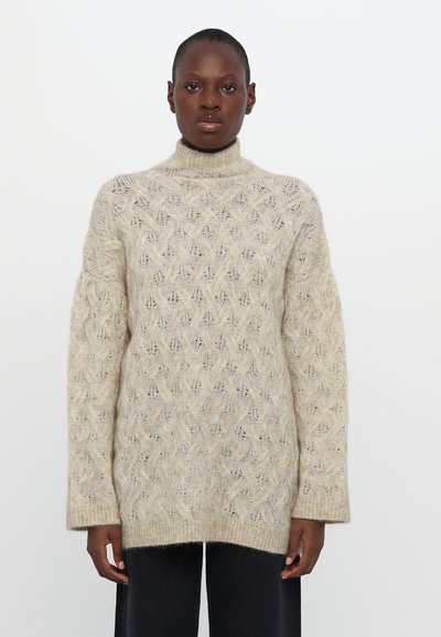 Long-sleeve, light beige sweater with a high neck, featuring a textured diamond pattern and ribbed cuffs, made from soft material.