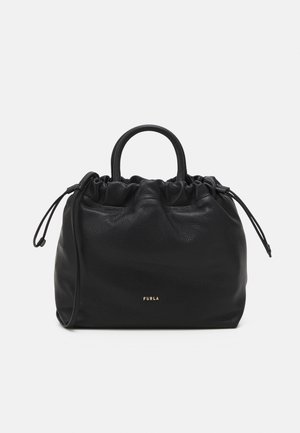 Black leather handbag with gathered top and a single handle. Features gold logo at the front and drawstring closures on the sides.