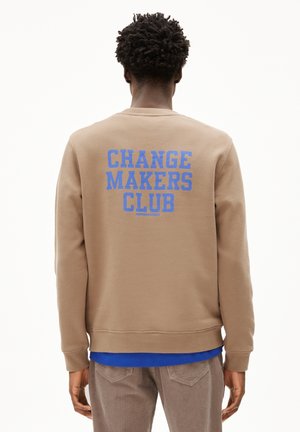 Brown cotton sweatshirt featuring a large blue graphic text "CHANGE MAKERS CLUB" on the back. Ribbed cuffs and hem.