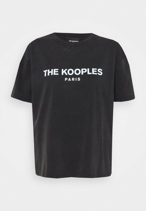 Black short-sleeve T-shirt with white text "THE KOOPLES PARIS" centered on the chest, crew neckline, and relaxed fit.