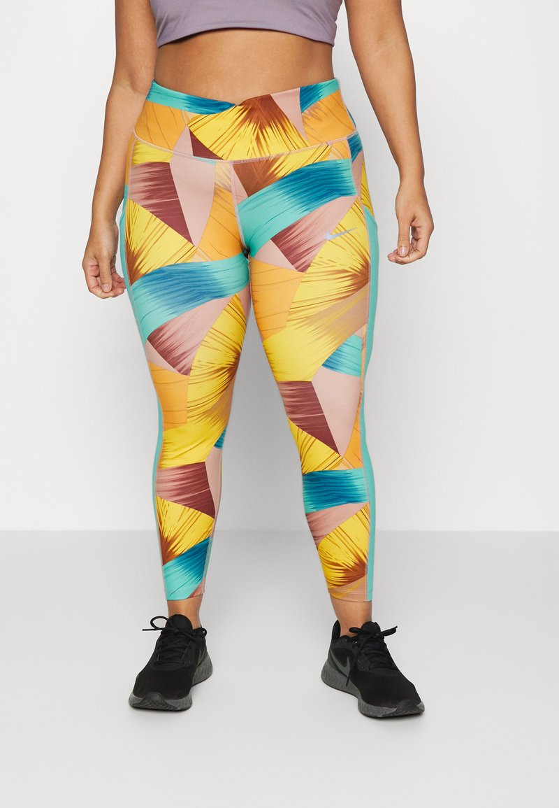Leggings coloridos e estampados com formas geométricas em azul, amarelo, rosa e castanho, com uma cintura alta e uma textura elástica e suave.