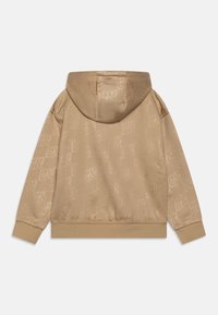 Felpa con cappuccio beige con motivo logo sottile, materiale in misto cotone, cappuccio con coulisse, polsini e orlo a costine. Texture liscia. Vista posteriore.