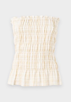Haut tube smocké en vichy jaune clair et blanc. Comprend un bord supérieur volanté et un motif froncé élastique sur toute la surface. Texture de tissu douce.