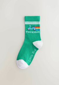 Green socks with white accents, featuring a blue scooter graphic and the word "THURSDAY" in white. Soft texture, mid-calf length.