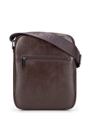 Brown leather crossbody bag with front zip pocket and wide adjustable strap embossed with brand name.
