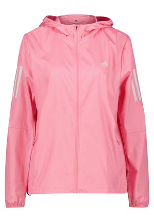 Veste légère à capuche Adidas rose avec fermeture éclair intégrale à l'avant, poignets élastiques, poches latérales et trois bandes réfléchissantes sur les deux manches.