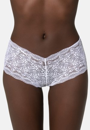 White lace boyshorts with floral patterns, soft texture, and a scalloped edge, featuring a central seam and elastic waistband.