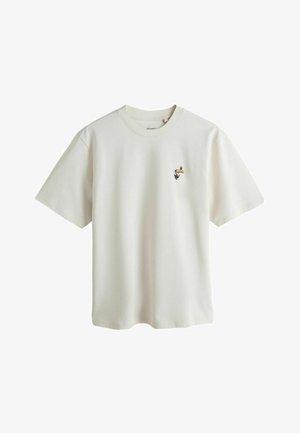 White short-sleeve crewneck t-shirt with small colorful toucan embroidery on the left chest.