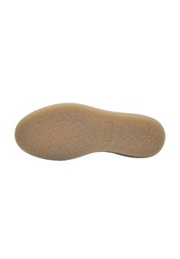 Suola di scarpa in gomma con una superficie texturizzata, caratterizzata da una forma arrotondata e di colore beige chiaro. Design semplice senza motivi o accenti visibili.