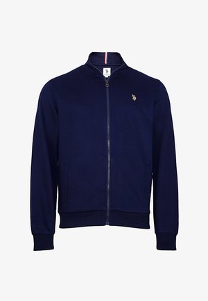 Marine blouson met rits van zachte stof. Voorzien van een staande kraag, twee voorzakken, geribde manchetten en een klein logo op de borst.