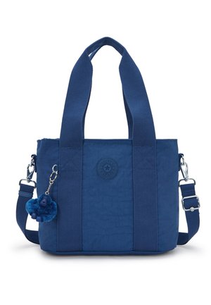 Blå nylon mulepose med brede håndtag, aftagelig skulderrem, rundt logopatch og en lille blød nøglering fastgjort.