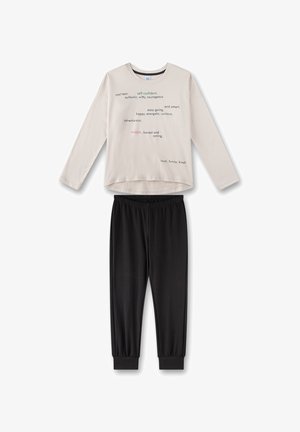 Light beige long-sleeve top with colorful text patterns, paired with black elastic waistband pants featuring ribbed cuffs at the ankles.