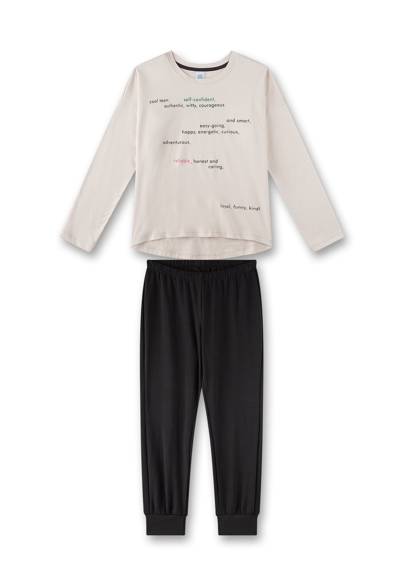 Light beige long-sleeve top with colorful text patterns, paired with black elastic waistband pants featuring ribbed cuffs at the ankles.