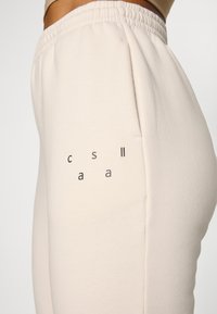Casall JOGGER - Calças de fato de treino - light sand