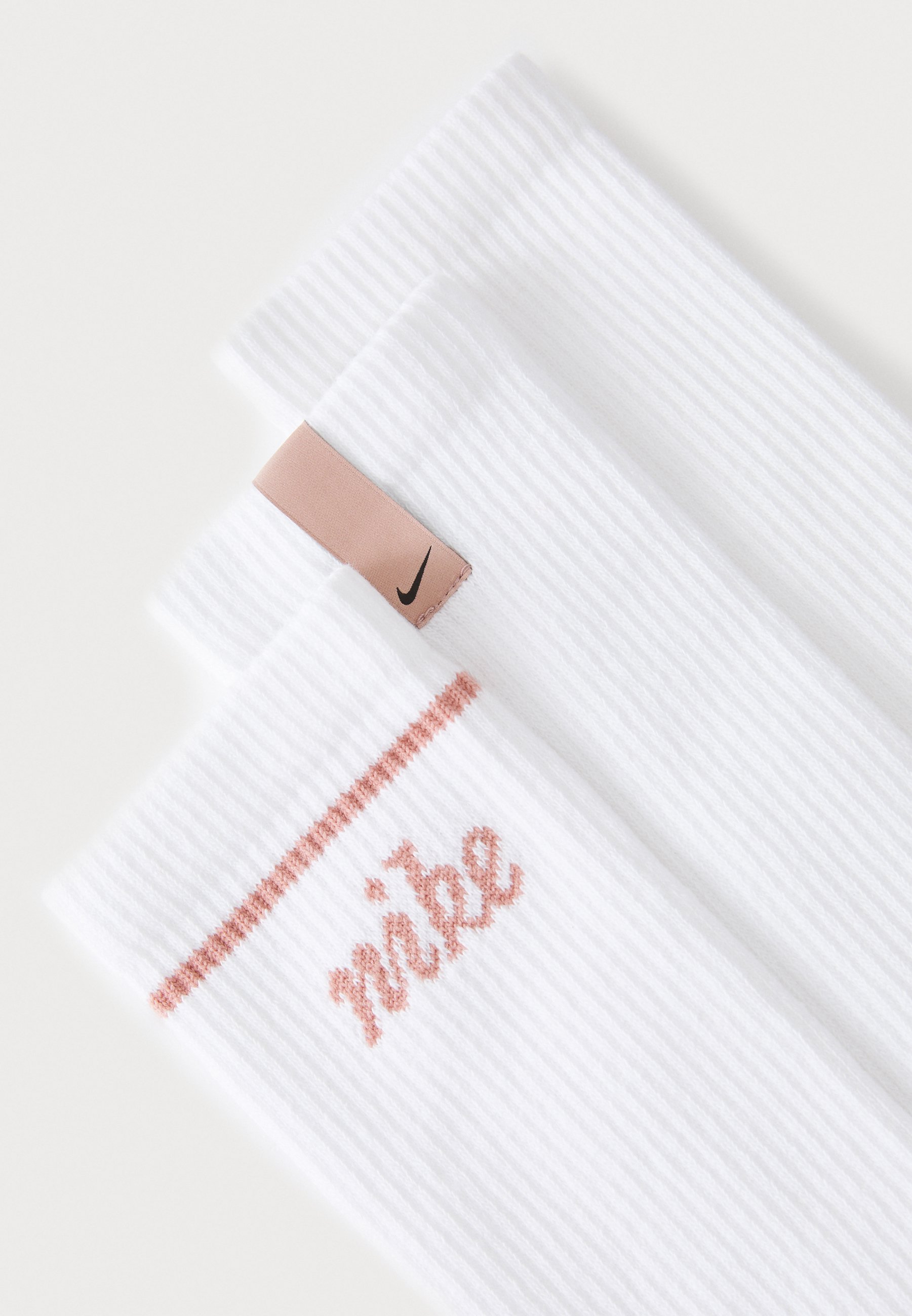 white nike socks with pink logo