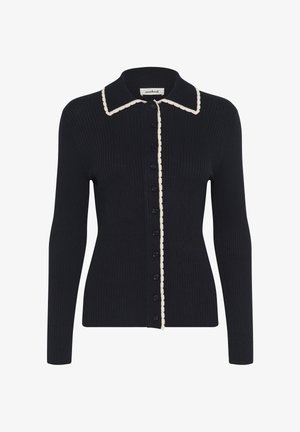 Must mustriga kardigan pikkade varrukatega, kreemjatest lainelistes äärtes kaeluses ja nööpide joones, ning mustad nööbid esiküljel.