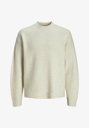 Helle beige Strickjacke mit einem strukturierten Waffelmuster. Mit hohem Kragen und gerippten Bündchen und Saum. Weicher, mittelschwerer Stoff.